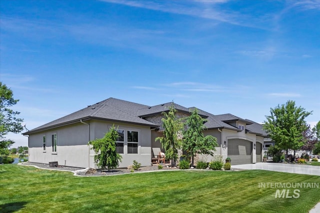 547 S Rivermist Ave, Star, ID 83669 - view of front of house featuring stucco siding, an attached garage, a front yard, and driveway