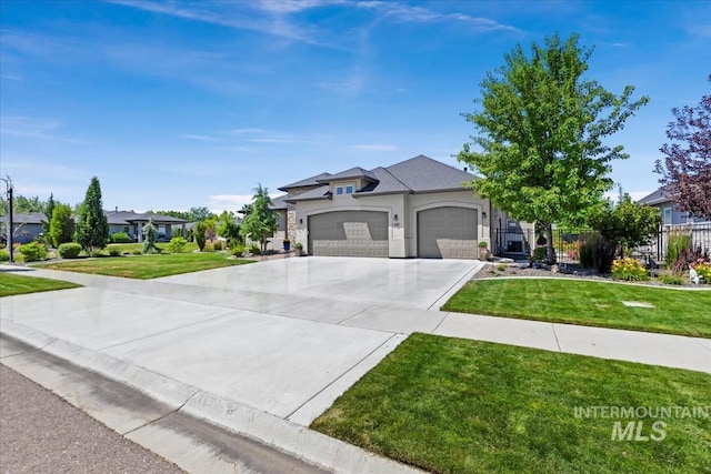 547 S Rivermist Ave, Star, ID 83669 - view of front of home with an attached garage, concrete driveway, and stucco siding