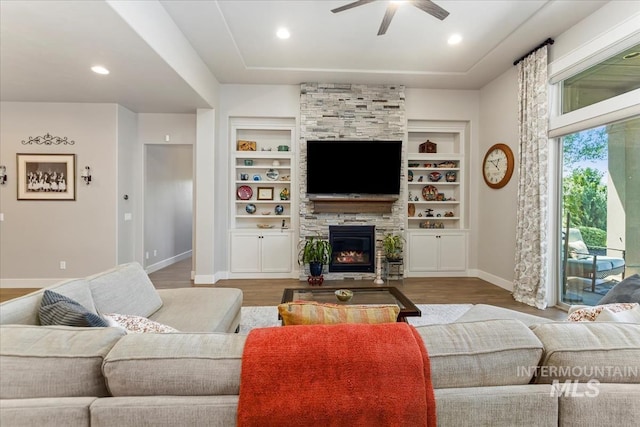 547 S Rivermist Ave, Star, ID 83669 - living room featuring ceiling fan, wood finished floors, a fireplace, built in shelves, and recessed lighting