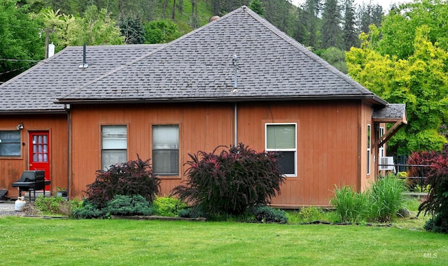 830 Riverside Ave, Orofino, ID 83544 - view of property exterior with roof with shingles and a lawn