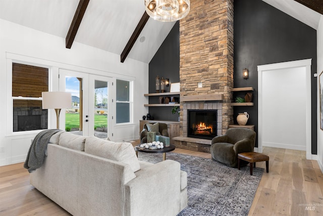 living room with beam ceiling, light wood-style flooring, high vaulted ceiling, and a fireplace