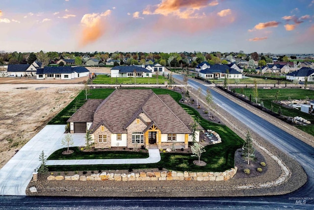 aerial view at dusk with a residential view