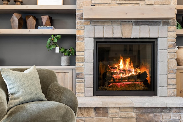 room details with a stone fireplace