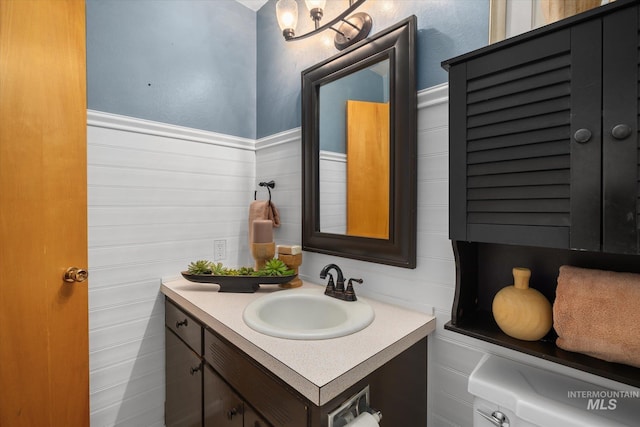 222 Dawn St, Eagle, ID 83616 - bathroom featuring vanity and wainscoting