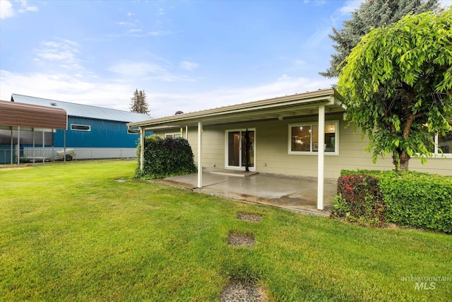 222 Dawn St, Eagle, ID 83616 - rear view of house with a patio and a lawn