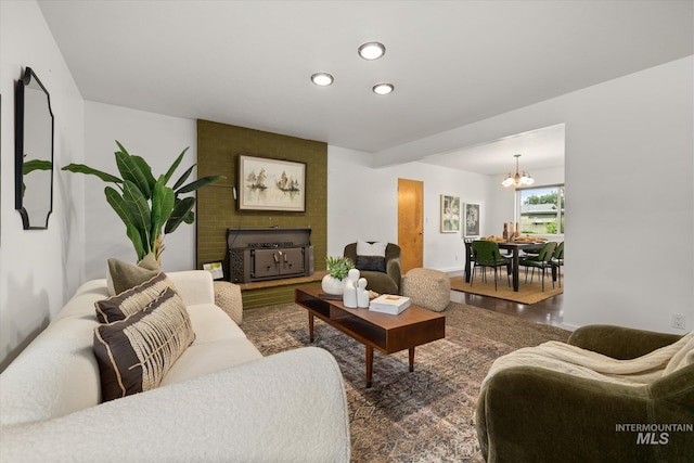 222 Dawn St, Eagle, ID 83616 - living area featuring a chandelier, a fireplace, wood finished floors, and recessed lighting