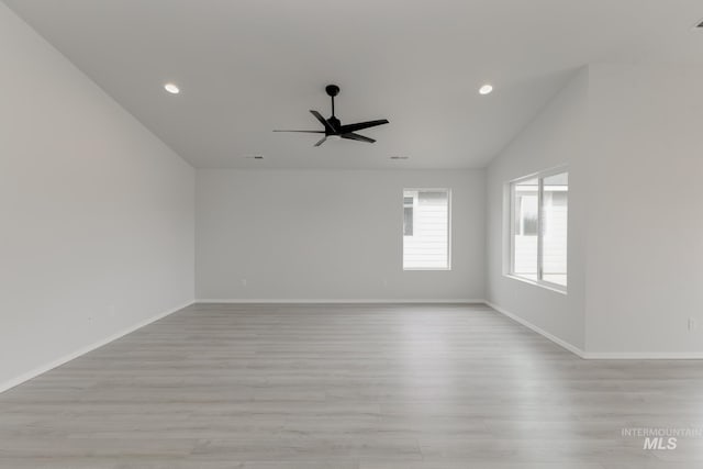 3937 W Tribute St, Meridian, ID 83642 - empty room featuring light wood-type flooring, baseboards, a ceiling fan, and recessed lighting