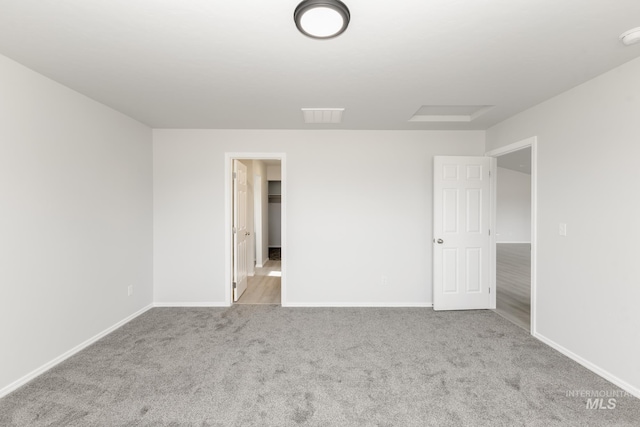 3937 W Tribute St, Meridian, ID 83642 - unfurnished bedroom featuring baseboards, a spacious closet, attic access, and carpet floors