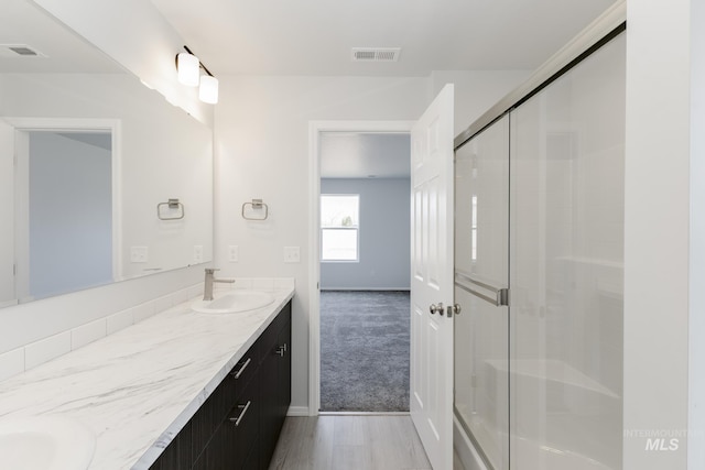 3937 W Tribute St, Meridian, ID 83642 - full bath featuring a sink, double vanity, a shower stall, and visible vents