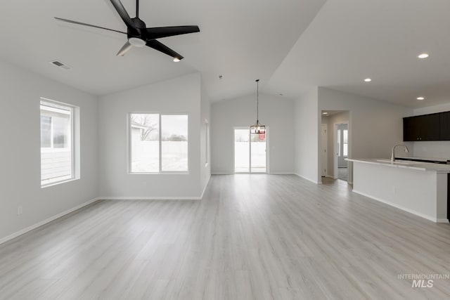 3937 W Tribute St, Meridian, ID 83642 - unfurnished living room with visible vents, ceiling fan, light wood-style floors, lofted ceiling, and recessed lighting