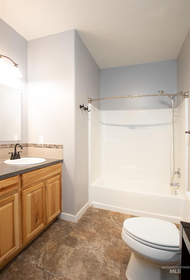 full bathroom with vanity, toilet, and bathtub / shower combination