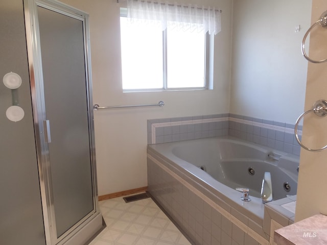 full bath with tile patterned floors, visible vents, a shower stall, and a jetted tub