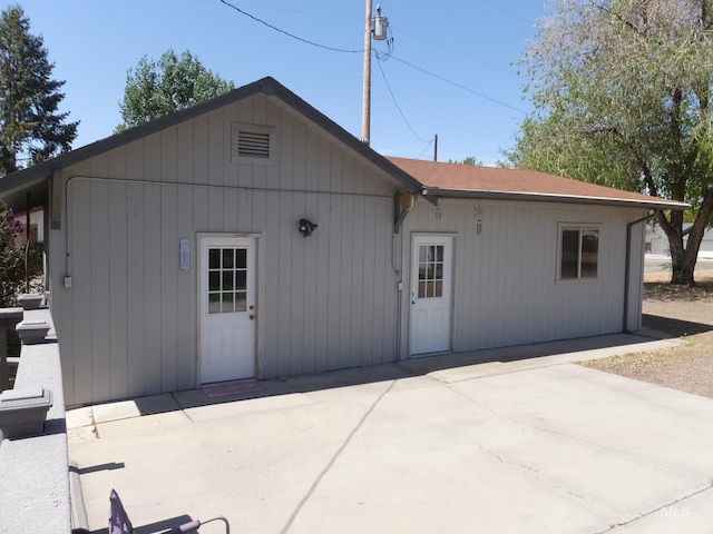 back of house with a patio