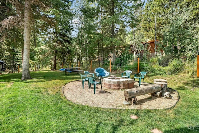 view of yard with an outdoor fire pit