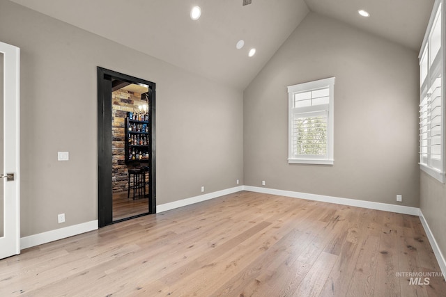 1358 N Morehouse Ave, Eagle, ID 83616 - unfurnished bedroom with multiple windows, light wood-style flooring, recessed lighting, access to exterior, and high vaulted ceiling