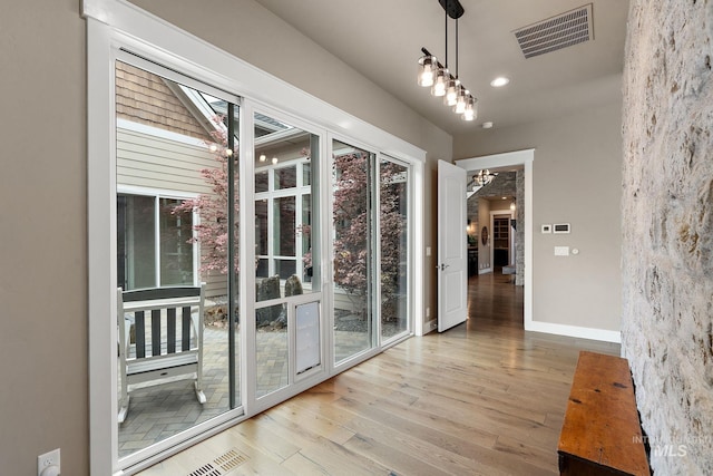 1358 N Morehouse Ave, Eagle, ID 83616 - unfurnished dining area with wood finished floors, baseboards, a chandelier, and recessed lighting