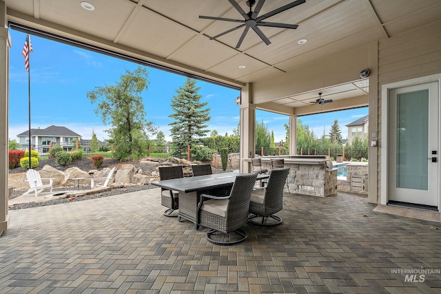 1358 N Morehouse Ave, Eagle, ID 83616 - view of patio / terrace with a ceiling fan, an outdoor kitchen, a fenced backyard, and outdoor dining area