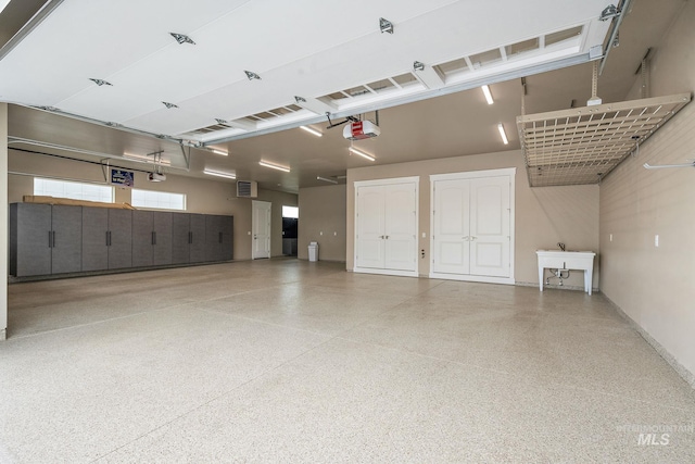 1358 N Morehouse Ave, Eagle, ID 83616 - garage featuring a garage door opener and baseboards