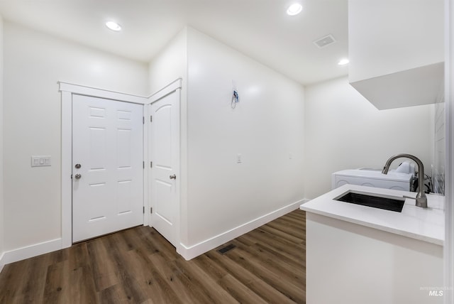 corridor with visible vents, dark wood-style flooring, and recessed lighting