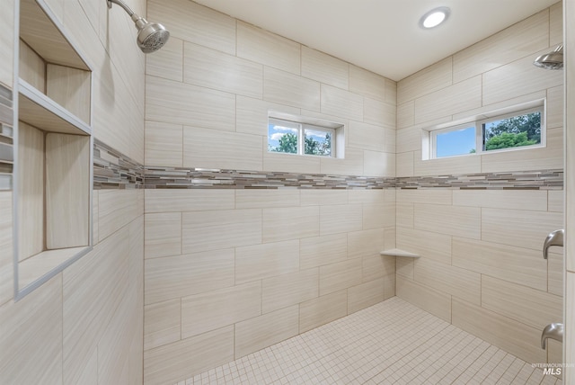 bathroom featuring tiled shower