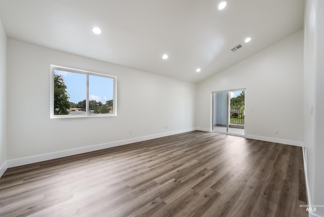 empty room with recessed lighting, visible vents, baseboards, and wood finished floors