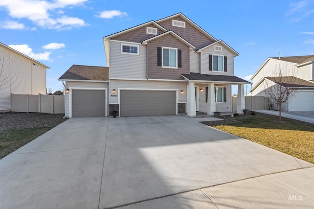 view of front facade with a garage and a front lawn