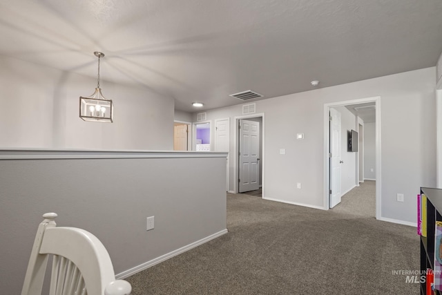 unfurnished room featuring dark colored carpet