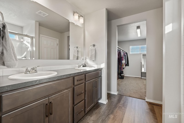 bathroom with vanity and hardwood / wood-style flooring