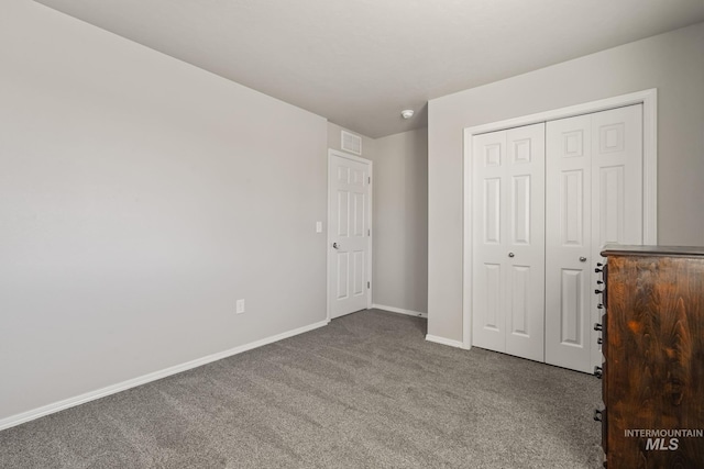 unfurnished bedroom with carpet and a closet