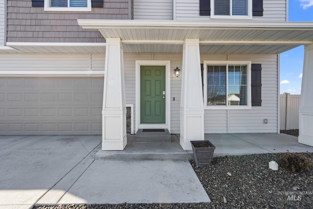 doorway to property with a garage