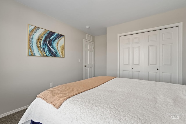 carpeted bedroom with a closet