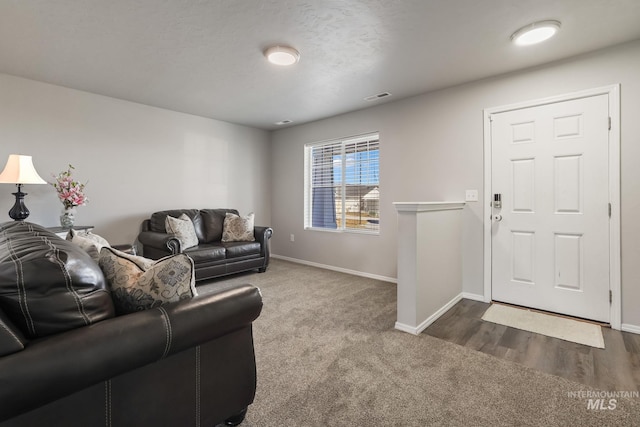 living room featuring dark carpet