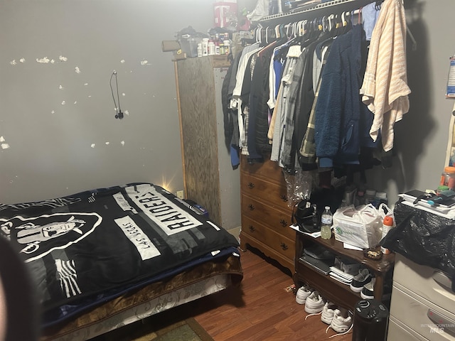 bedroom with wood finished floors