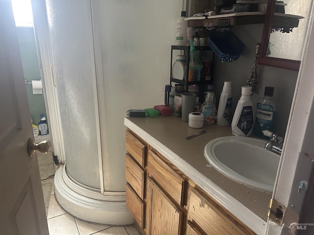 bathroom with vanity, a shower stall, and tile patterned floors