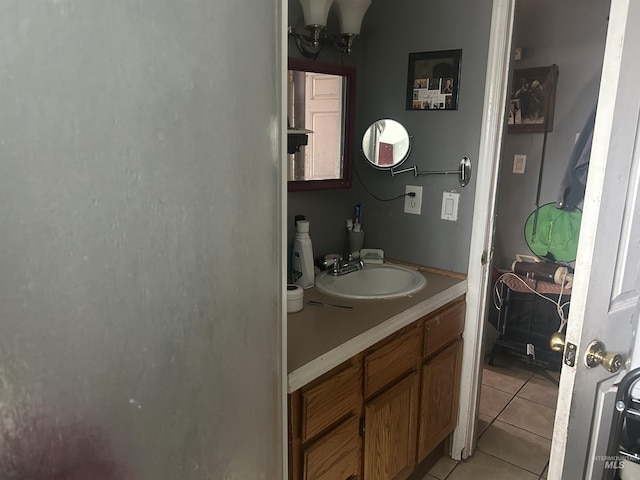 bathroom with tile patterned floors and vanity