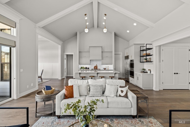 living room with wood-type flooring, beamed ceiling, and high vaulted ceiling