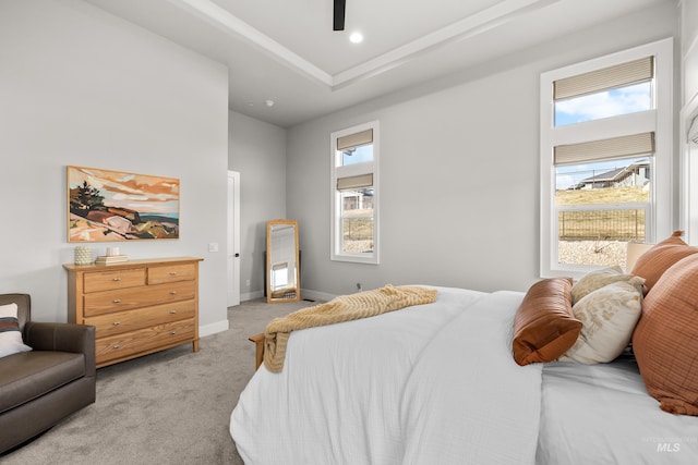 bedroom featuring light carpet and ceiling fan