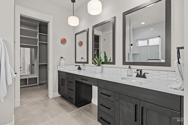 bathroom with vanity and a shower