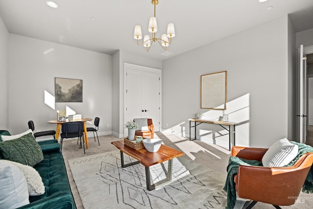 carpeted living room with an inviting chandelier