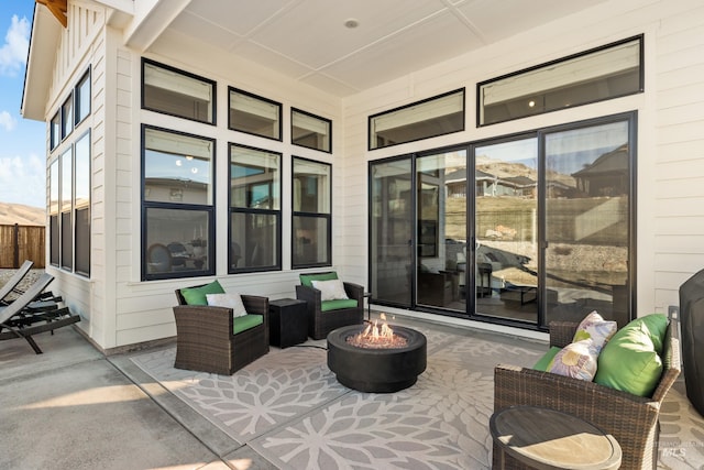 view of patio / terrace with an outdoor fire pit