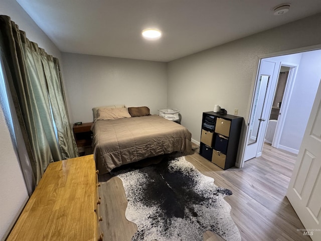 bedroom featuring wood finished floors
