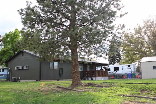 view of yard with central air condition unit