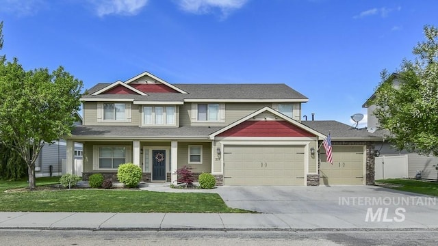 craftsman-style house with a garage and a front lawn