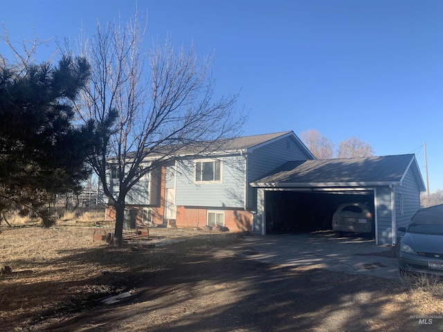 view of side of home featuring a garage