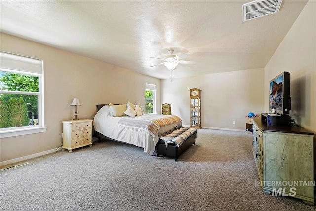 bedroom featuring carpet flooring, visible vents, and baseboards