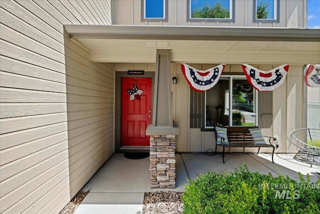 property entrance with board and batten siding