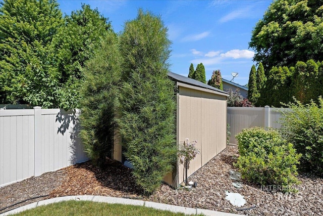 view of outbuilding with an outbuilding and fence