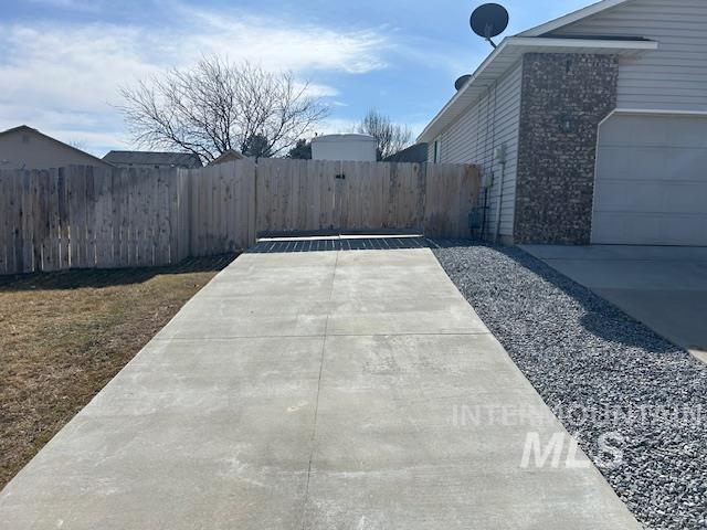 view of patio featuring fence