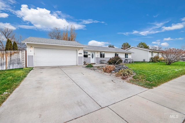 ranch-style home with a garage and a front yard