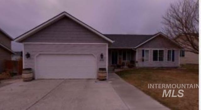 single story home featuring a garage